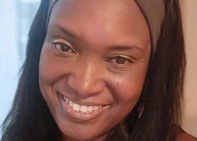 Smiling woman at Life Story Coach By Jenni, Birmingham, England, GB, embracing joy and wellness.
