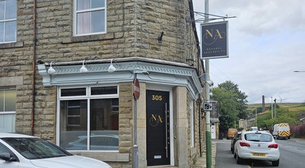 Exterior of Alana Fores Nails and Makeup in Shawforth, England. A welcoming stone facade with signage.