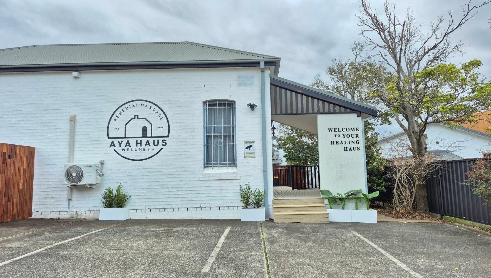 Entrance of Aya Haus Massage & Day Spa in Shellharbour, New South Wales, AU, showcasing welcoming facade.