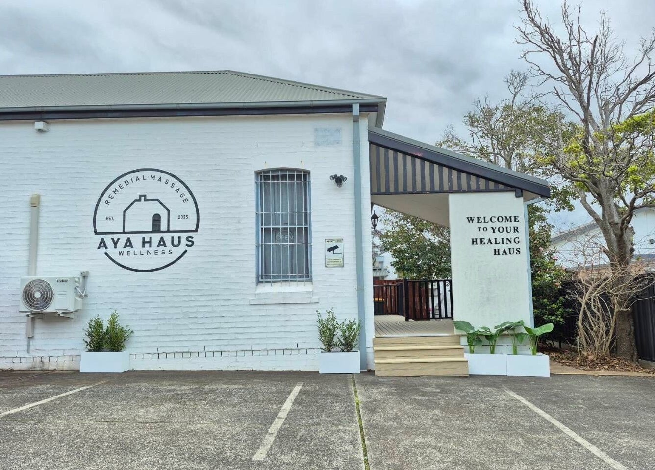 Entrance of Aya Haus Massage & Day Spa in Shellharbour, New South Wales, AU, showcasing welcoming facade.