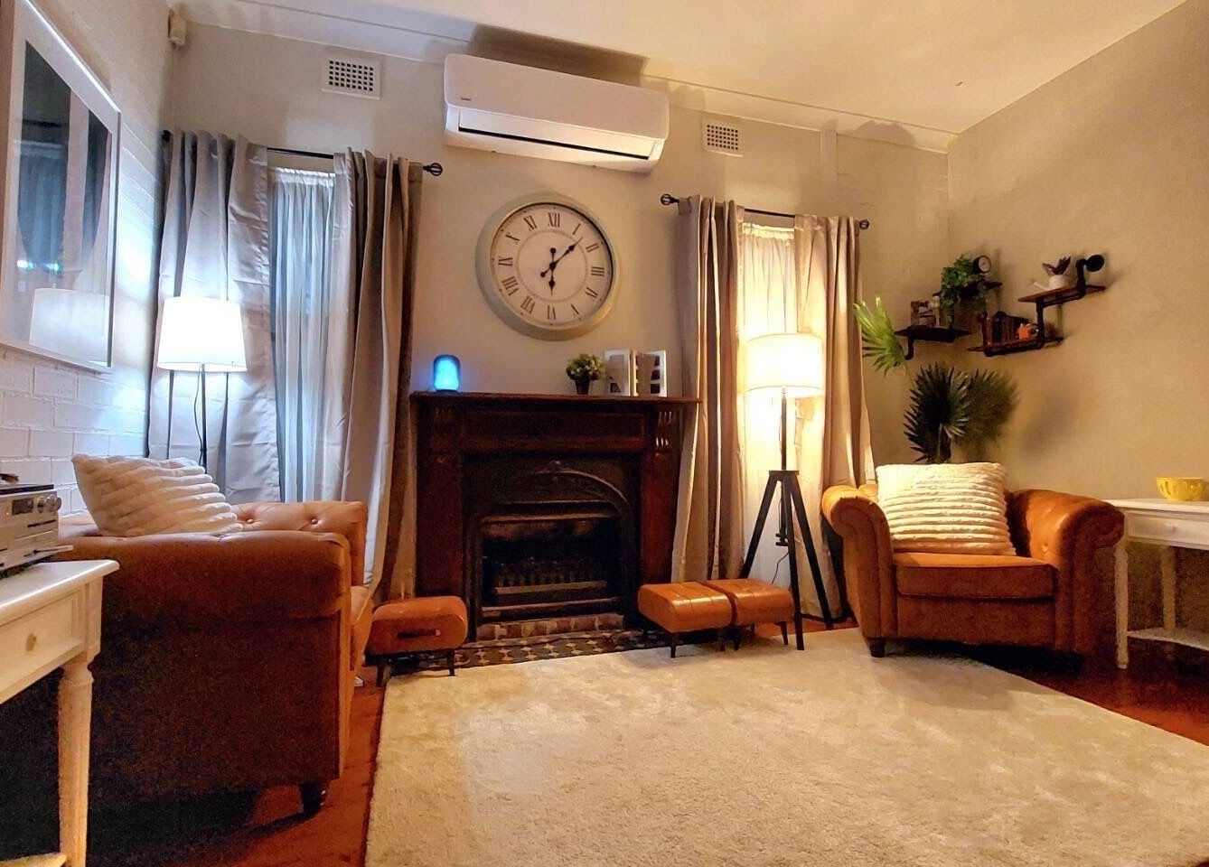 Relaxing lounge area at Aya Haus Massage & Day Spa, Shellharbour, New South Wales, AU with plush chairs and decor.