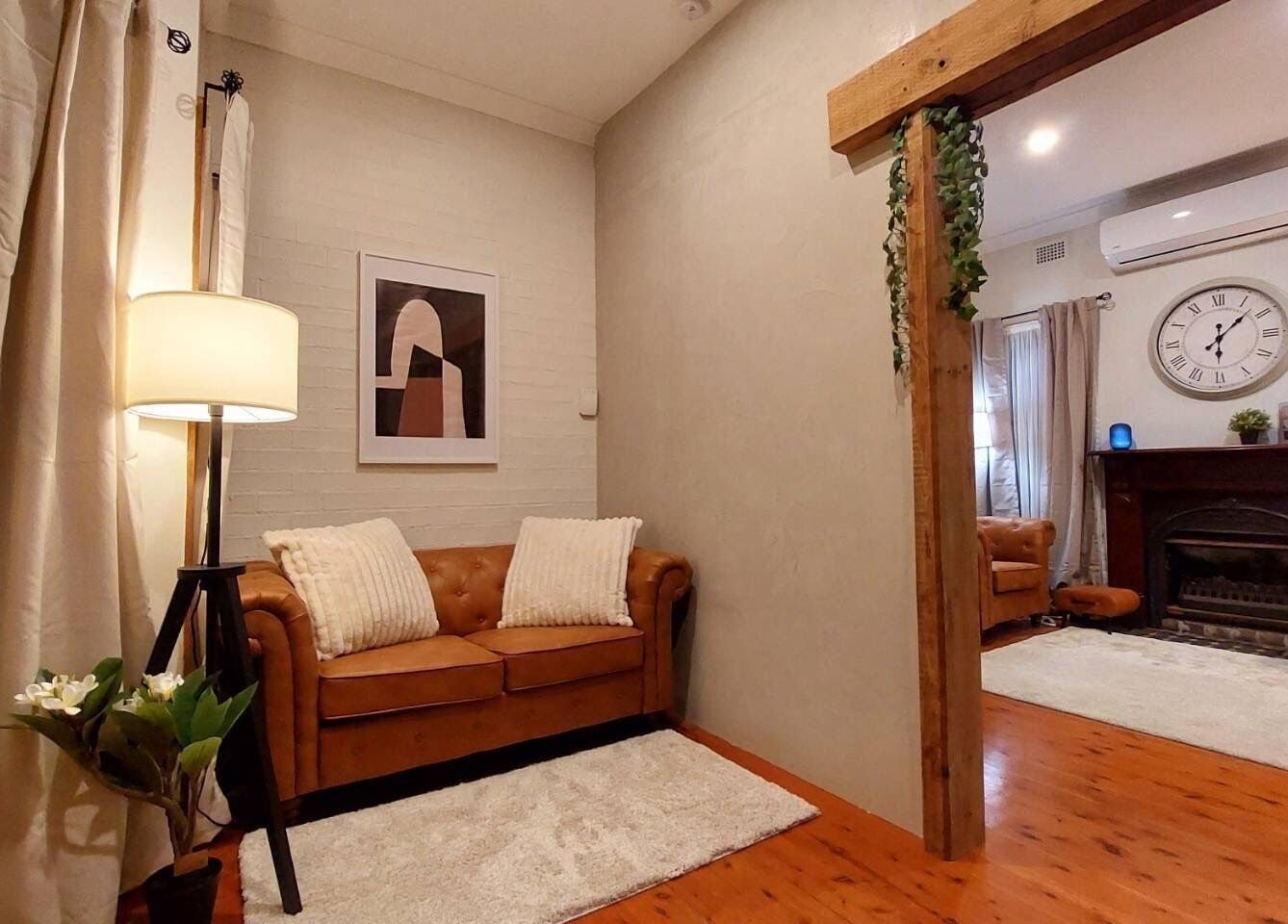 Cozy lounge at Aya Haus Massage & Day Spa, Shellharbour, New South Wales, AU with soft lighting and elegant decor.