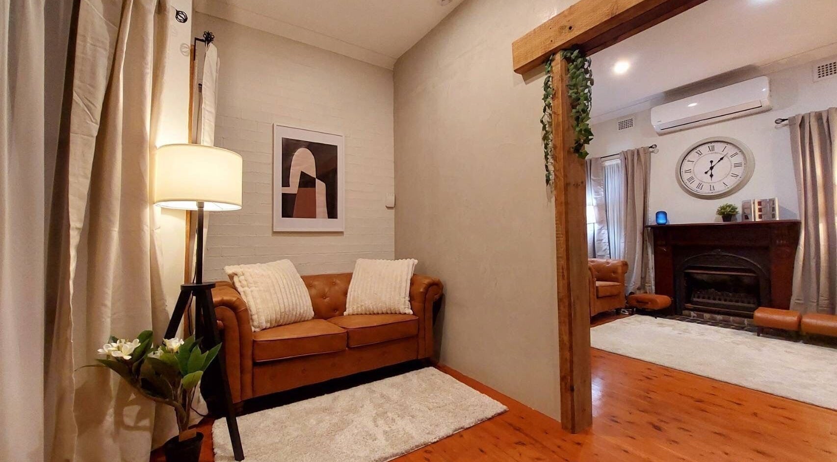 Cozy lounge at Aya Haus Massage & Day Spa, Shellharbour, New South Wales, AU with soft lighting and elegant decor.