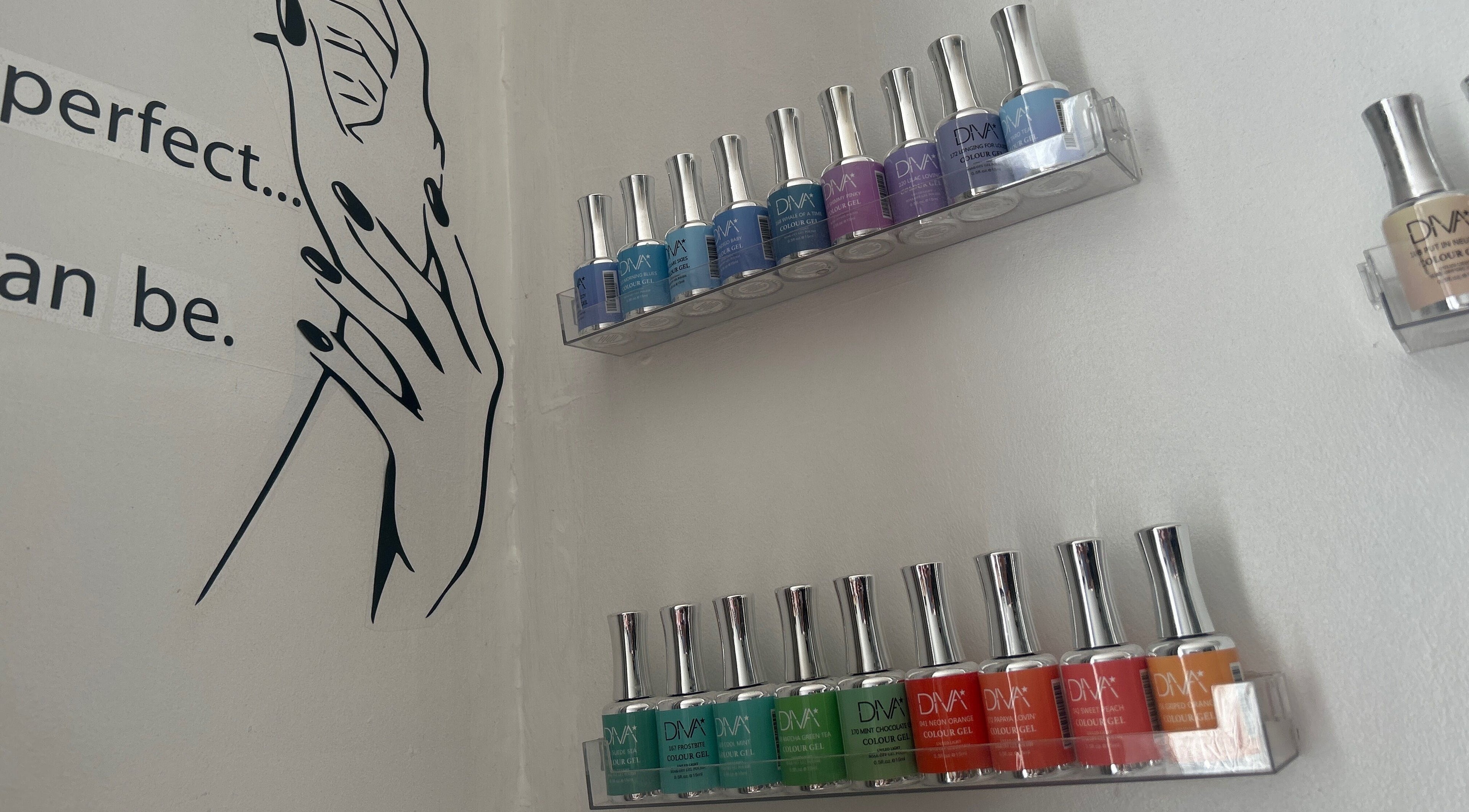 Nail polish display at Luxe Beauty Lounge, Coventry, England, GB enhances salon's elegant ambiance.