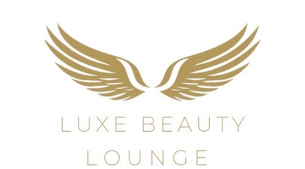 Golden wing logo of Luxe Beauty Lounge in Coventry, England, GB.