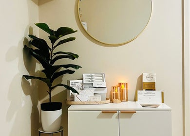 Modern decor corner at Beautique Smiles, Dunlop, AU featuring a plant and golden accents.