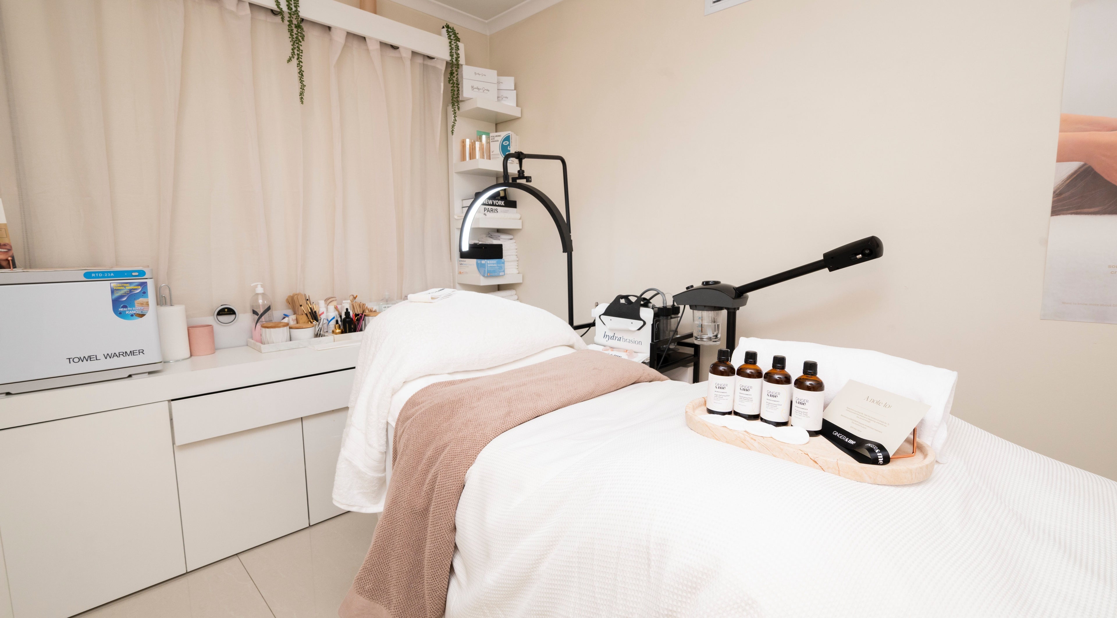 Relaxing treatment room at Beautique Smiles, Dunlop, Australian Capital Territory, AU with skincare products.