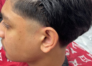Fresh haircut with a stylish fade at trimgudbyhadi in Luton, England, GB.