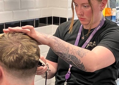 Stylist working on a haircut at Hair By Shann, Chester, England, GB salon.