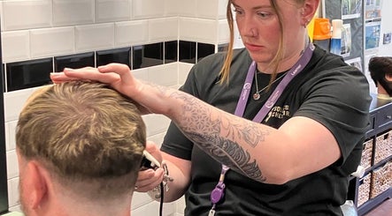 Stylist working on a haircut at Hair By Shann, Chester, England, GB salon.
