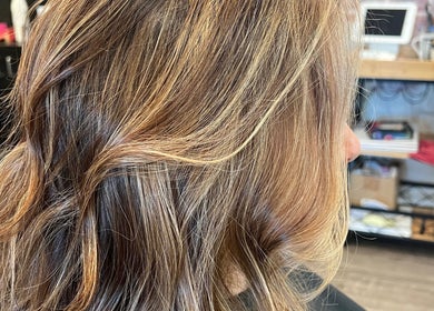 Blonde highlights on wavy hair at Hair by Alisha -Pine Grove, Pine Grove, California, US.