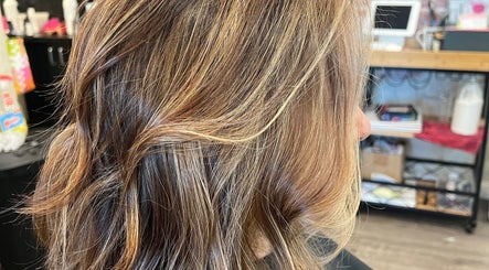 Blonde highlights on wavy hair at Hair by Alisha -Pine Grove, Pine Grove, California, US.