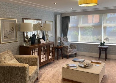 Sophisticated seating area at London & Surrey Aesthetics, London, England, GB with chic decor and natural light.