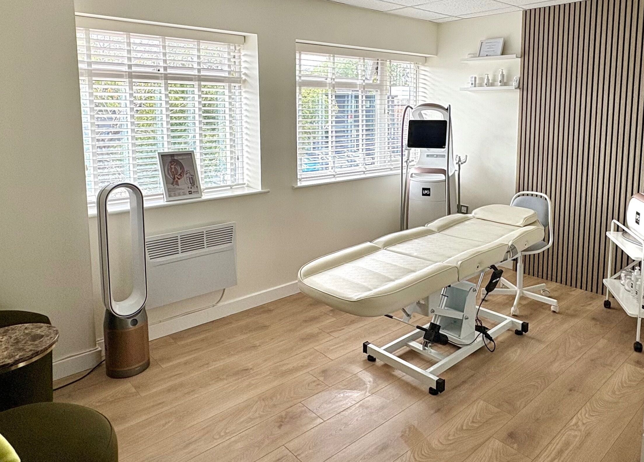 Relaxing treatment room at Daniva Wellness, Cuffley, GB, with massage table and soothing decor.