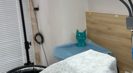 Therapy room at yen beauty studio, Hồ Chí Minh, Hồ Chí Minh, VN with calming decor and massage table.