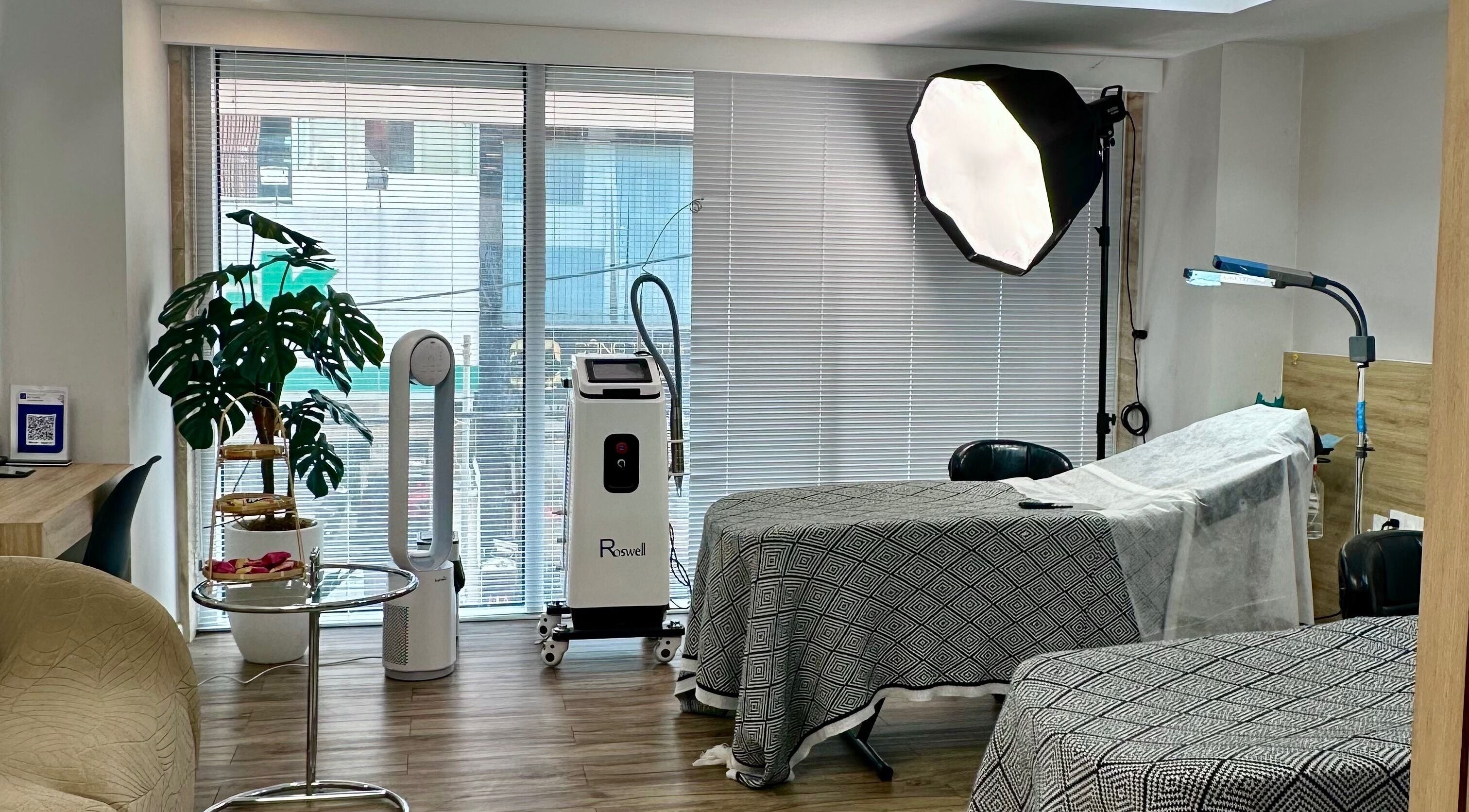 Relaxing treatment room at yen beauty studio, Hồ Chí Minh, VN, featuring modern equipment and natural light.