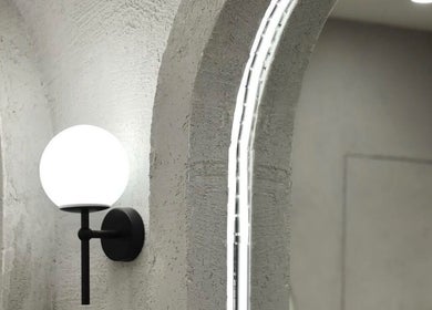 Modern wall light fixture at Maryané Beauté, Darlinghurst, New South Wales, AU, highlighting minimalist elegance.