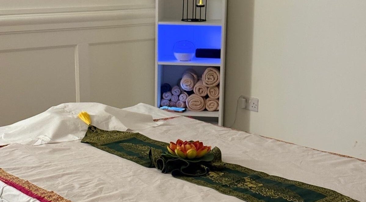 Serene massage room at Balance Massage Healing, Glasgow, Scotland, GB with a bed and calming decor.