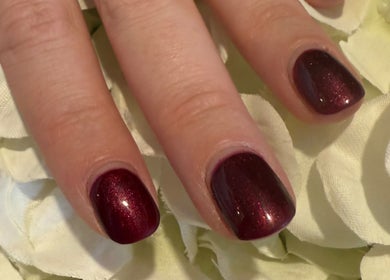 Stylish burgundy manicure at Aurora Beauty Studio, Newton Poppleford, England, GB.