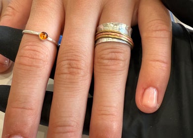 Hand with fresh nail polish at Aurora Beauty Studio, Newton Poppleford, England, GB. Perfectly styled manicure.