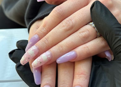 Lavender manicured nails with cloud designs at Aurora Beauty Studio, Newton Poppleford, England, GB.