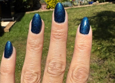 Blue glitter nails at Aurora Beauty Studio, Newton Poppleford, England, GB, showcasing expert manicure.