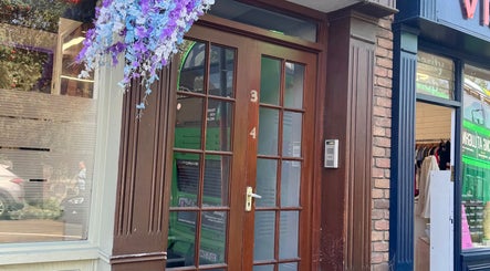 Front entrance of Recovery Massage & Wellness by Roberta, Lucan, County Dublin, IE, with flowers above door.