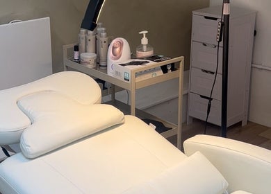 Serene treatment room at ūme, featuring a white massage table in London, England, GB.