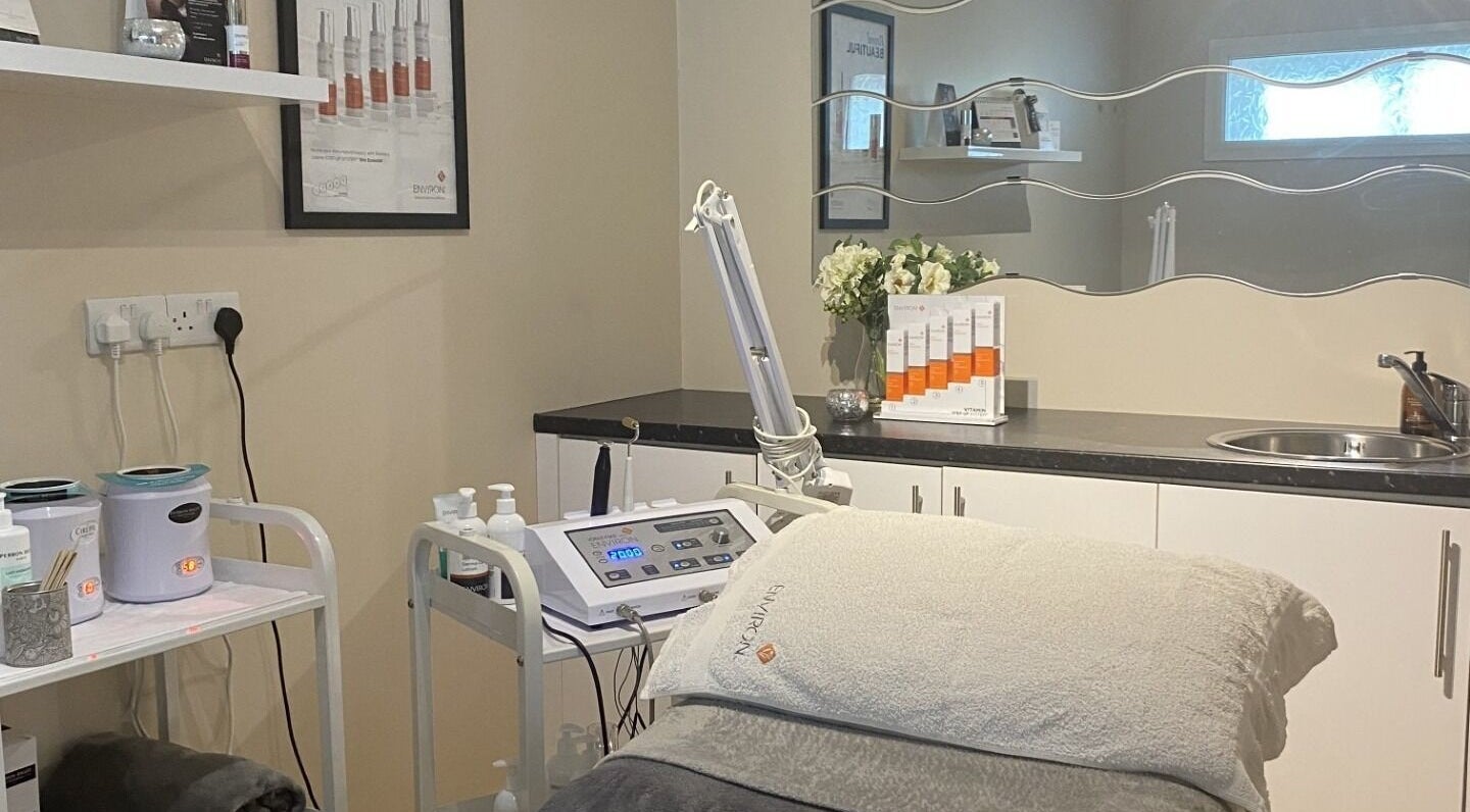 Luxurious treatment room at Pecyn Pert, Aberystwyth, Wales, GB, featuring modern beauty equipment and cozy decor.