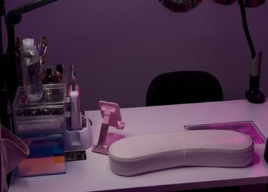 Stylish nail station at The Nail Bar by Cortni, La Marque, Texas, US, featuring a sleek white manicure table.