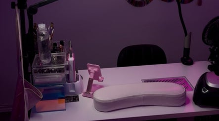 Stylish nail station at The Nail Bar by Cortni, La Marque, Texas, US, featuring a sleek white manicure table.