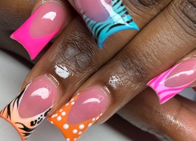 Colorful nail designs at The Nail Bar by Cortni, La Marque, Texas, US. Features bright, artistic styles.