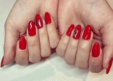 Elegant red manicure at Cambridge Beautician. Romsey Town, Cambridge, England, GB.