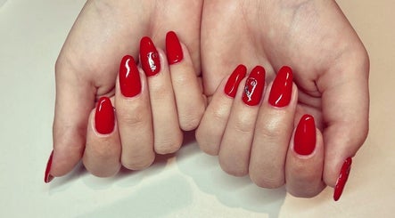 Elegant red manicure at Cambridge Beautician. Romsey Town, Cambridge, England, GB.