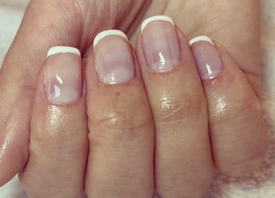Close-up of elegant French manicure at Cambridge Beautician, Romsey Town, Cambridge, England, GB.