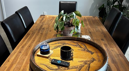 Elegant wooden table setting with plant at KJCleans, Manawatu, Manawatū-whanganui Region, NZ.