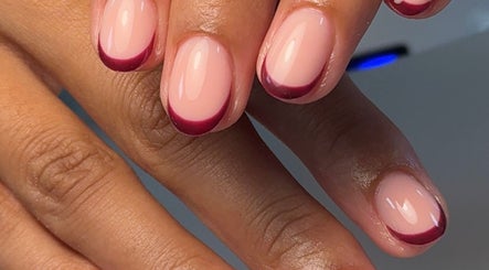 Elegant burgundy French manicure by Bybeccareay in Burton Latimer, England, GB.