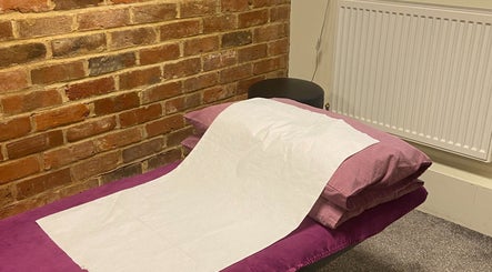 Relaxing treatment room at Matter of Clarity, Finchampstead, England, GB with a cozy setup.