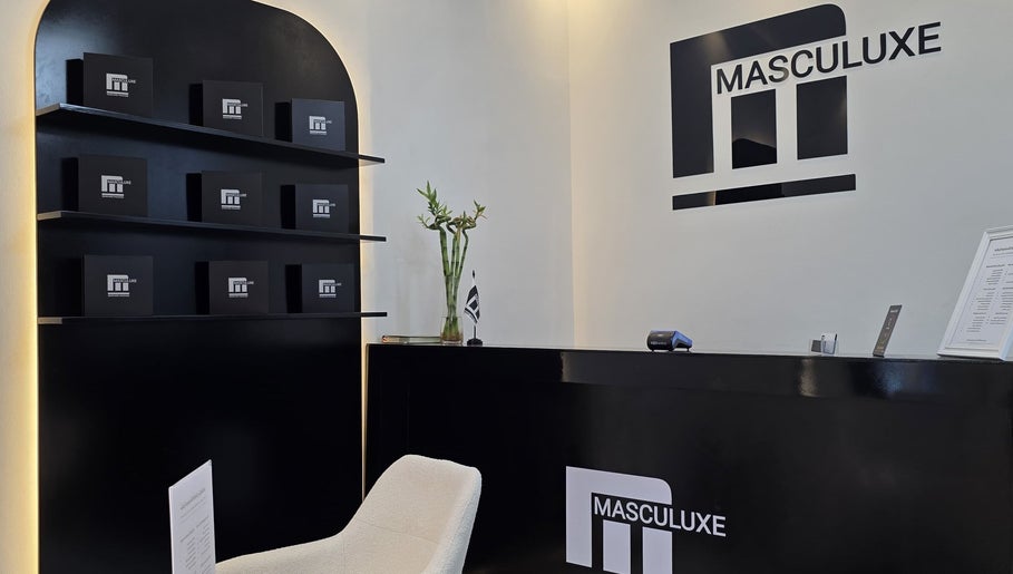 Elegant reception at Masculuxe Barbershop and Spa, مسقط, محافظة مسقط, OM, showcasing modern decor and branding.