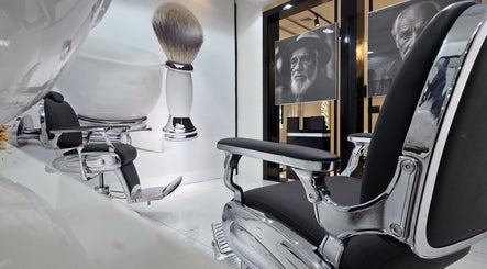 Sleek barbershop chairs at Masculuxe Barbershop and Spa in مسقط, محافظة مسقط, OM, offering modern grooming.