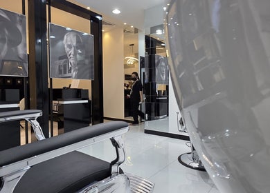 Modern interior of Masculuxe Barbershop and Spa with stylish chairs and decor in مسقط, محافظة مسقط, OM.