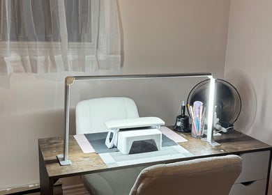 Elegant nail table at Heils.nails in Brantford, Ontario, CA, featuring manicure tools and ambient lighting.