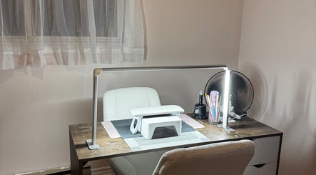 Elegant nail table at Heils.nails in Brantford, Ontario, CA, featuring manicure tools and ambient lighting.