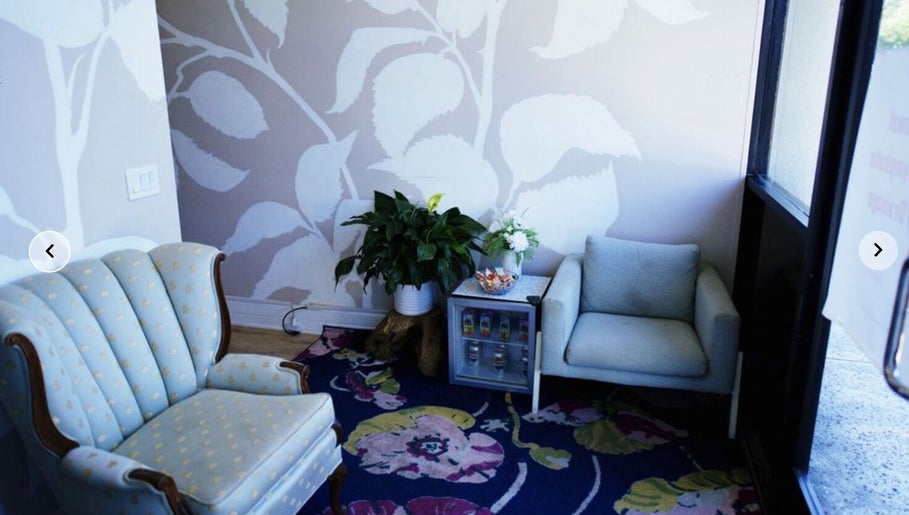 Elegant sitting area at Massage One Wellness, South Pasadena, CA, US with plush chairs and vibrant decor.