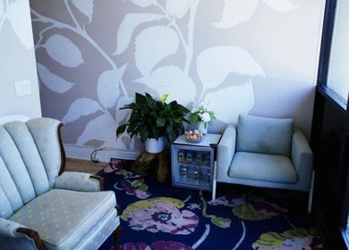 Elegant sitting area at Massage One Wellness, South Pasadena, CA, US with plush chairs and vibrant decor.