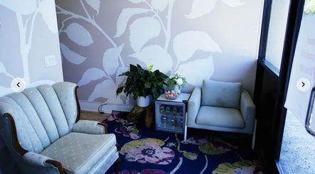 Elegant sitting area at Massage One Wellness, South Pasadena, CA, US with plush chairs and vibrant decor.