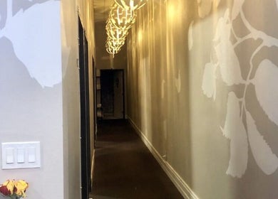 Stylish hallway with floral wall art at Massage One Wellness, South Pasadena, CA, US.