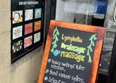 Chalkboard sign showcasing massage services at Massage One Wellness, South Pasadena, CA, US.