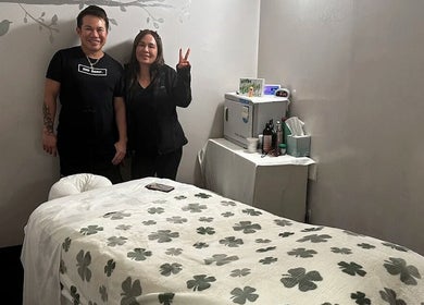 Massage One Wellness (Venice) treatment room in Venice, CA, US with staff and comfortable bed.