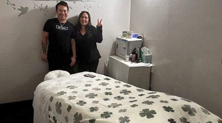 Massage One Wellness (Venice) treatment room in Venice, CA, US with staff and comfortable bed.